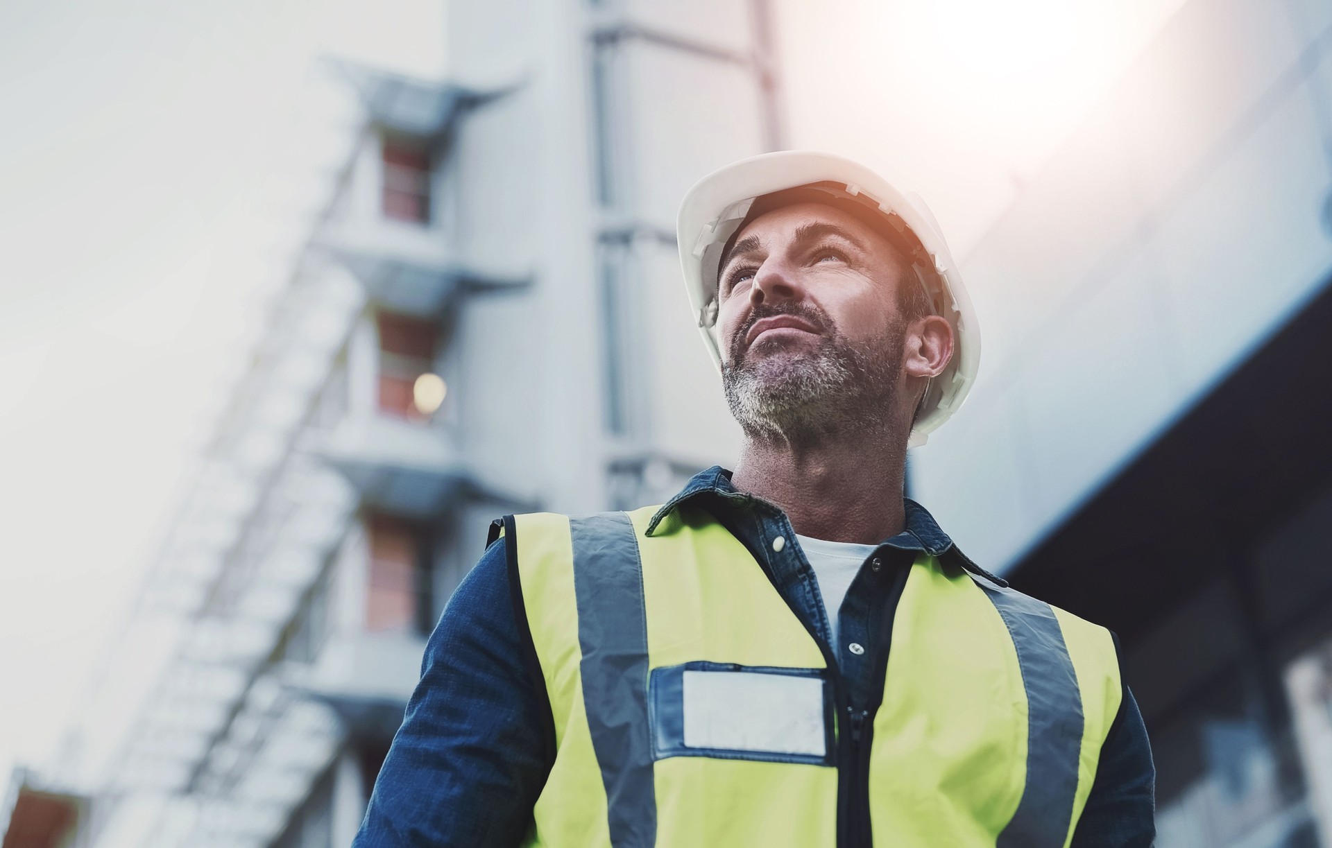 Man, construction and architect thinking outside, building vision and plan or property development. Professional, inspection and architecture site or decision, engineering design and employee or idea